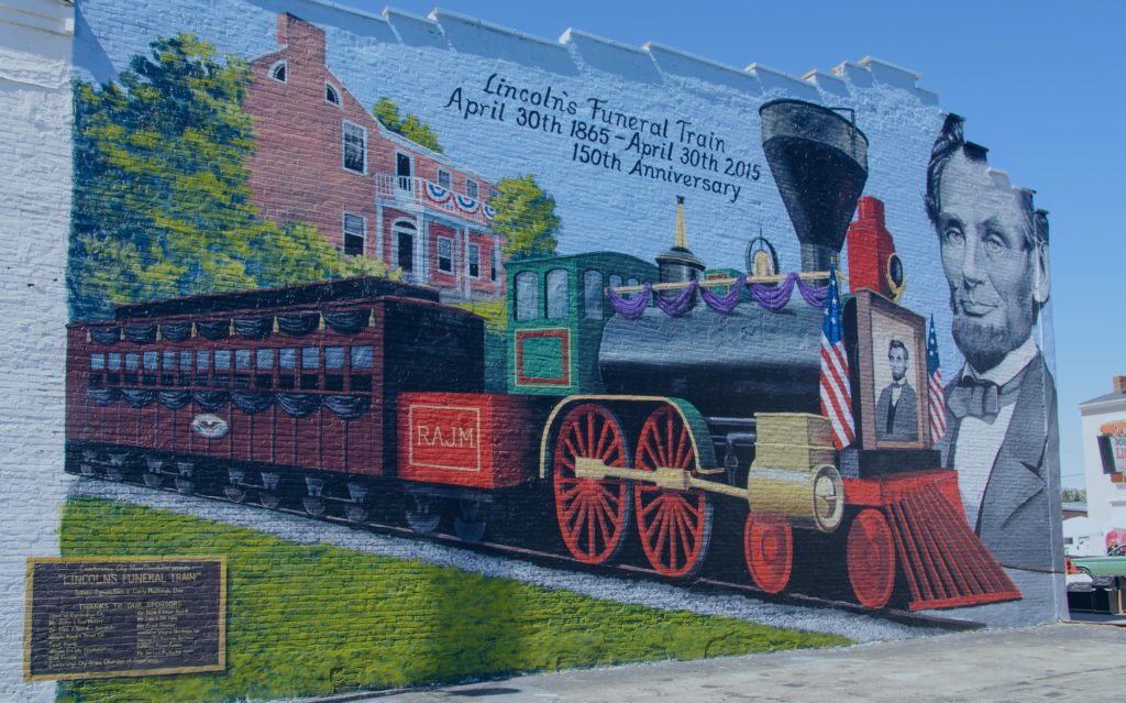 A mural of a railroad and Abraham lincoln on a wall in Richmond, Indiana.
